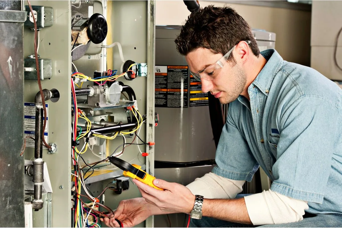 service technician testing a furnace