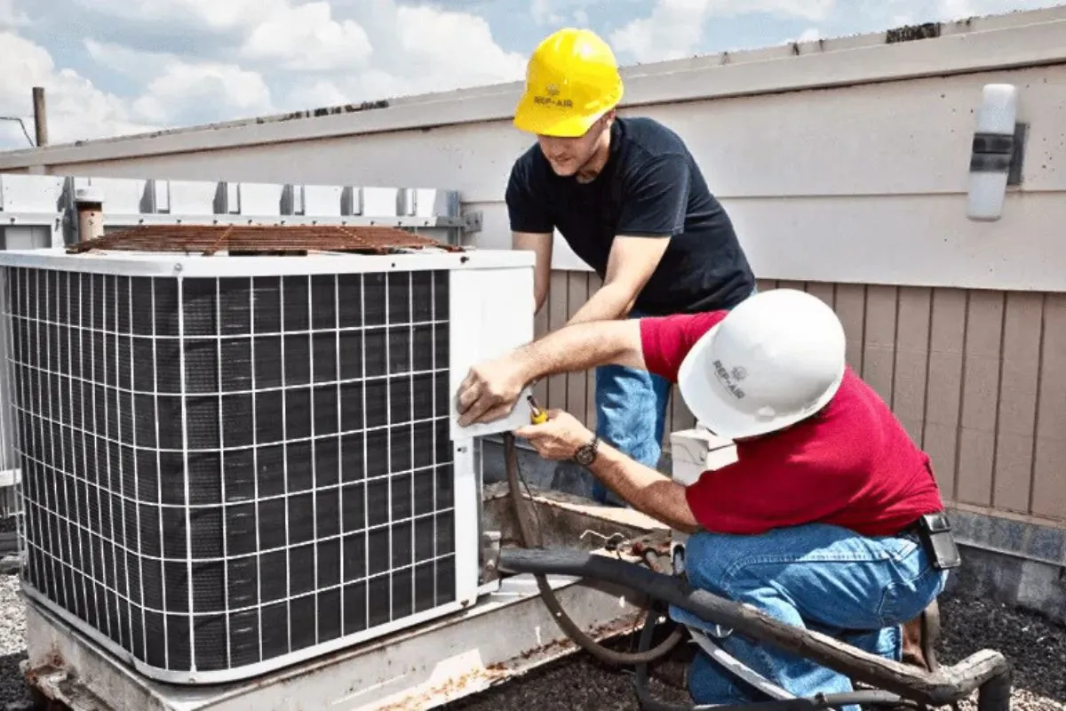 two contractors installing HVAC