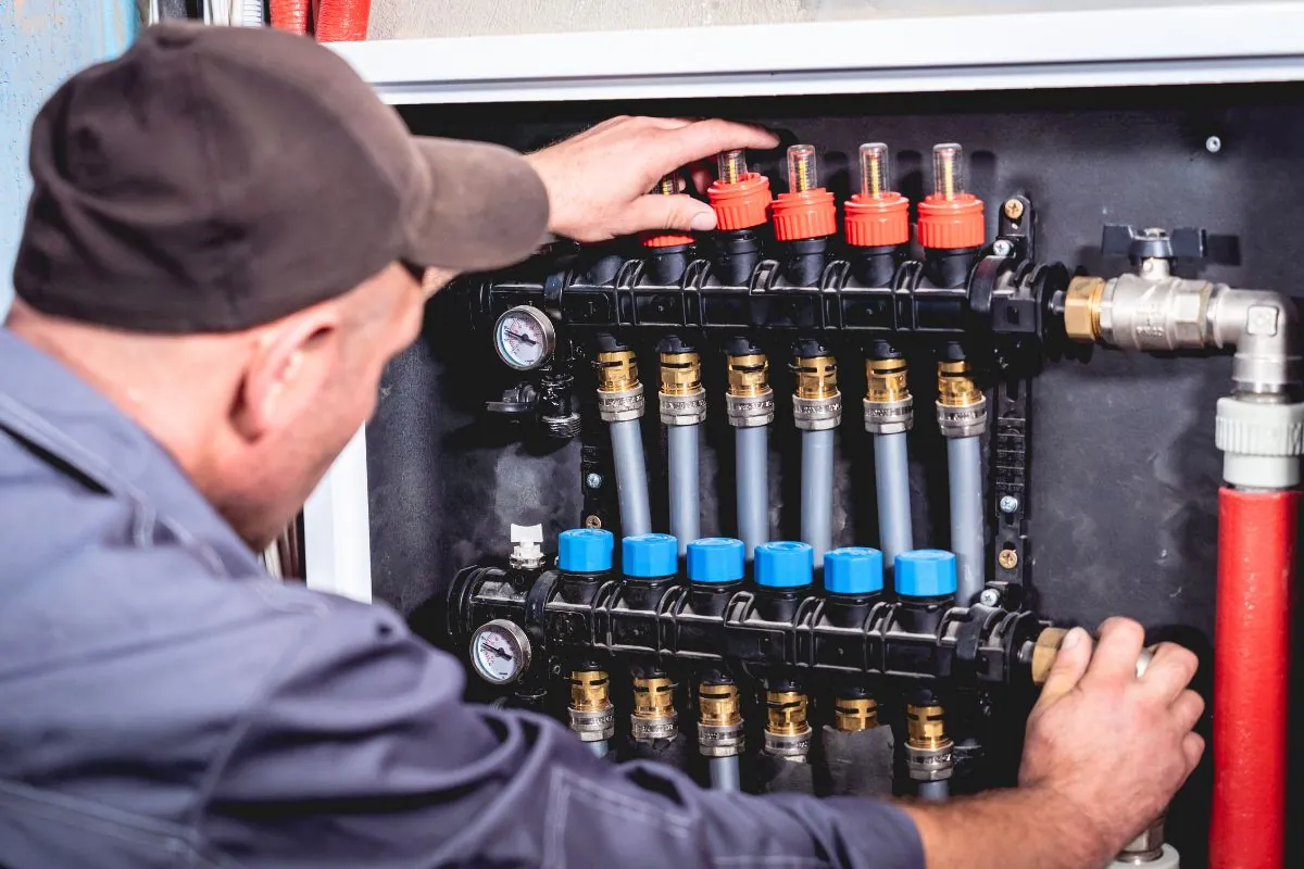 hvac technician servicing home heating and cooling system