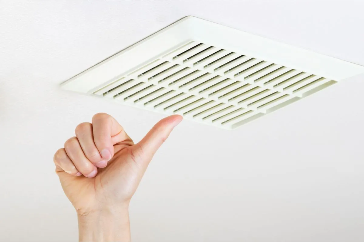 thumbs up after successfully cleaning fan vent