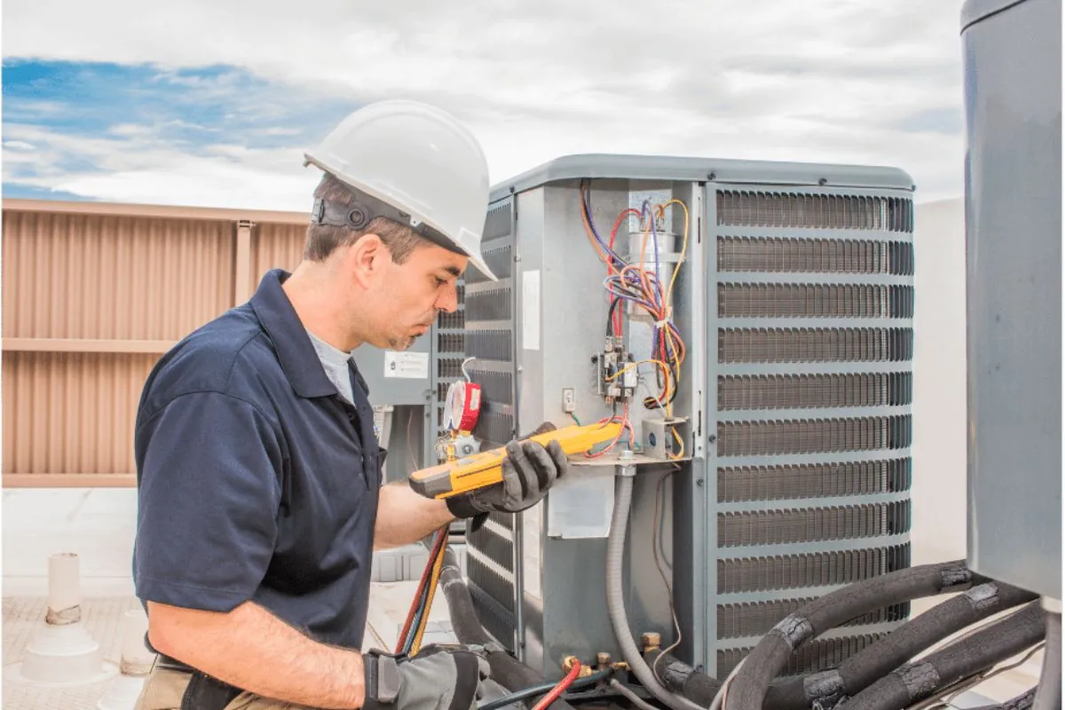 HVAC tech working on a condensing unit