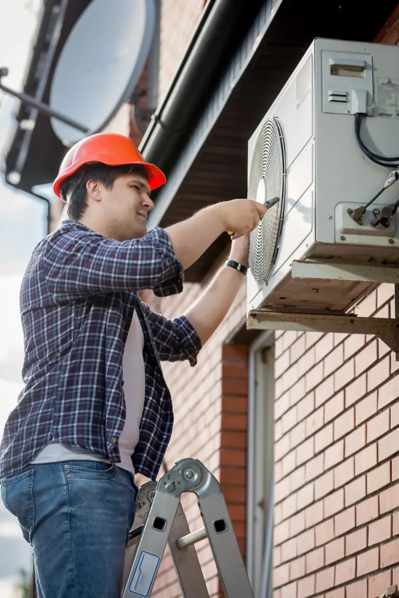 male technician repairing air condition unit in Albuquerque NM