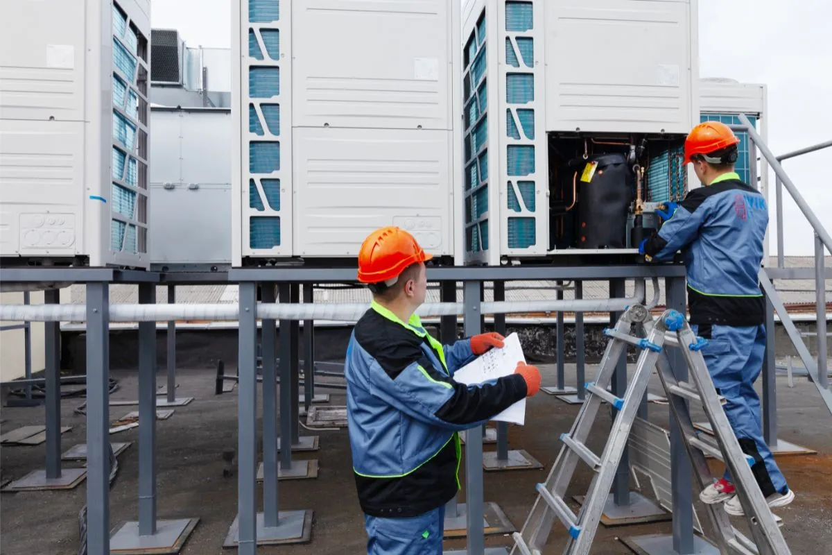 two technician inspecting ceiling ventilation in Albuquerque NM