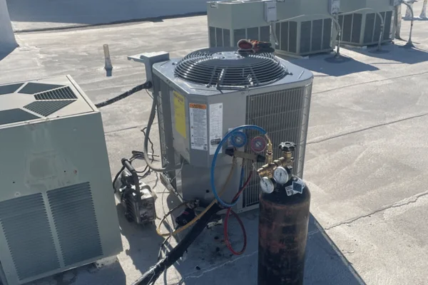 HVAC tech working on a condensing unit