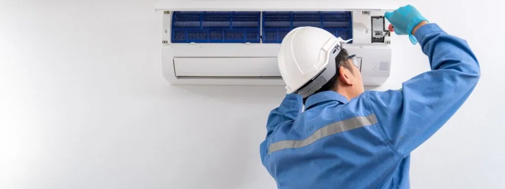 air conditioning technician installing air condition