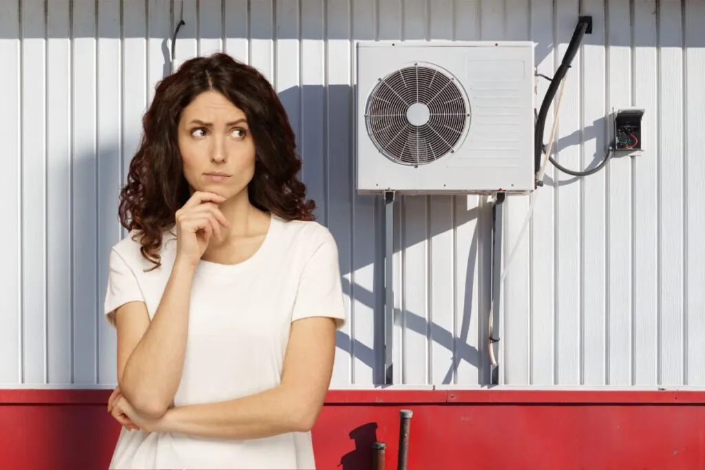 woman with heat pump on background